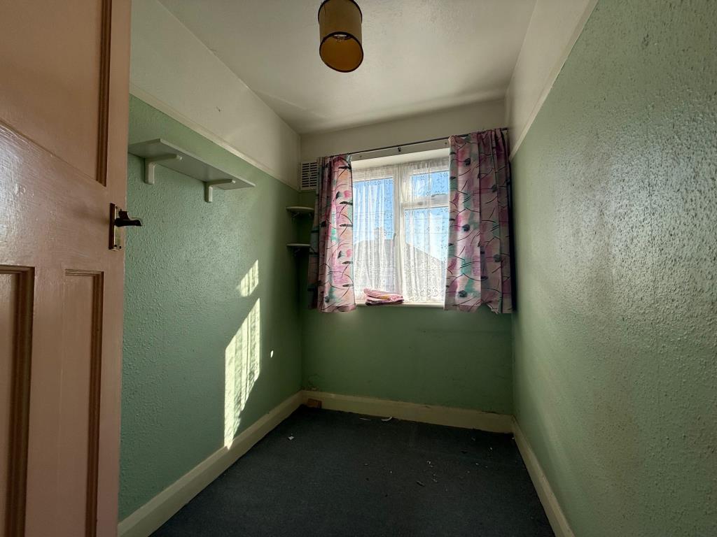 Lot: 109 - THREE-BEDROOM TERRACE HOUSE FOR IMPROVEMENT AND REFURBISHMENT - Bedroom with window to front aspect
